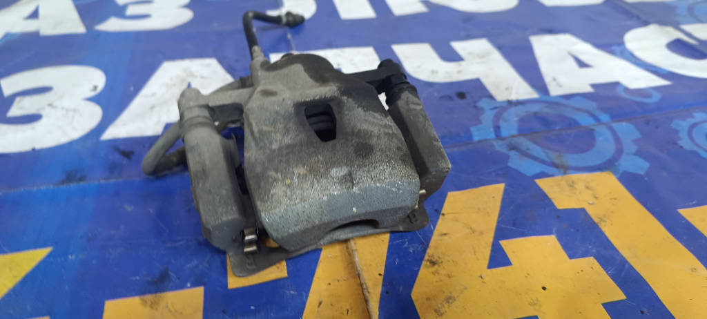Суппорт тормозной левый передний 4775052191 Toyota Vitz 2010 KSP90 1KRFE
