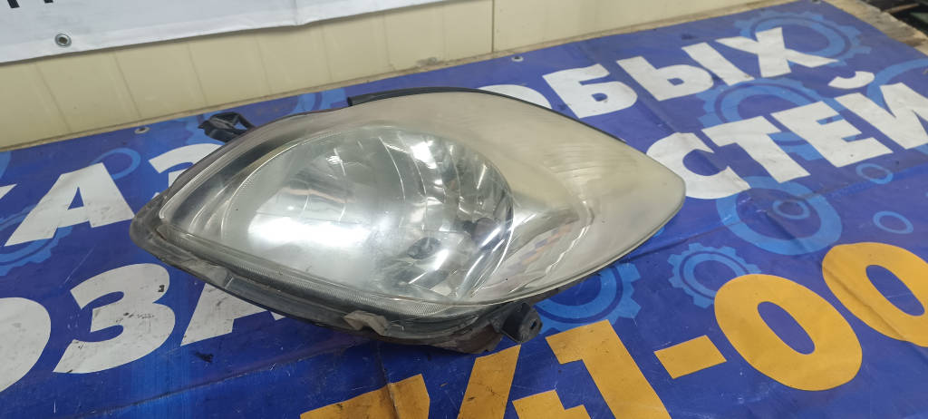 Фара левая 8115052560 Toyota Vitz 2010 KSP90 1KRFE