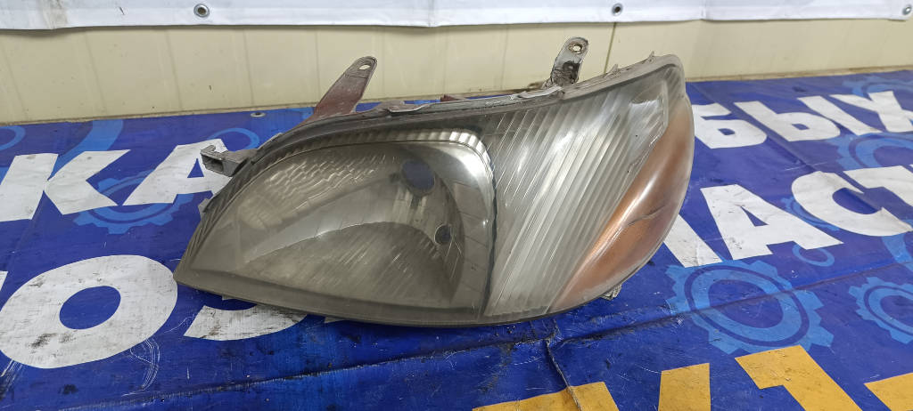 Фара левая Toyota Platz 2000 SCP11 1SZFE